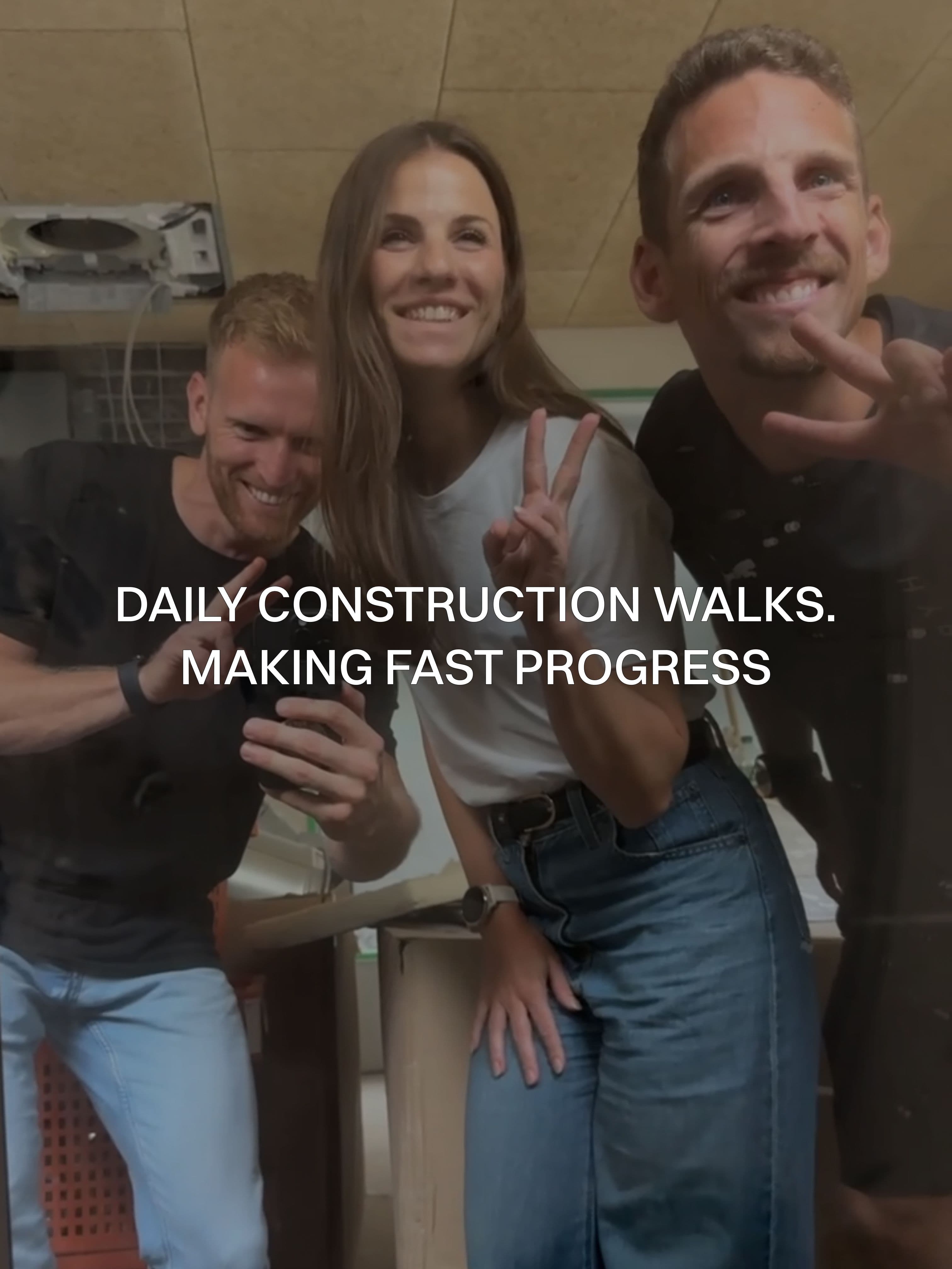 Three people on a daily construction walkthrough, checking the progress at THE BACE.
